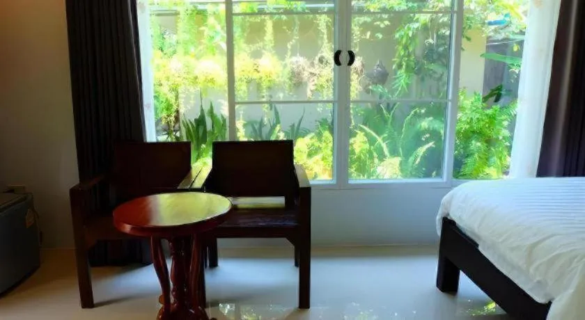 Bed in Rommai Rimnaam Resort