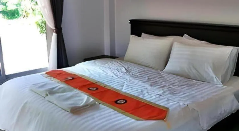 Bed in Rommai Rimnaam Resort