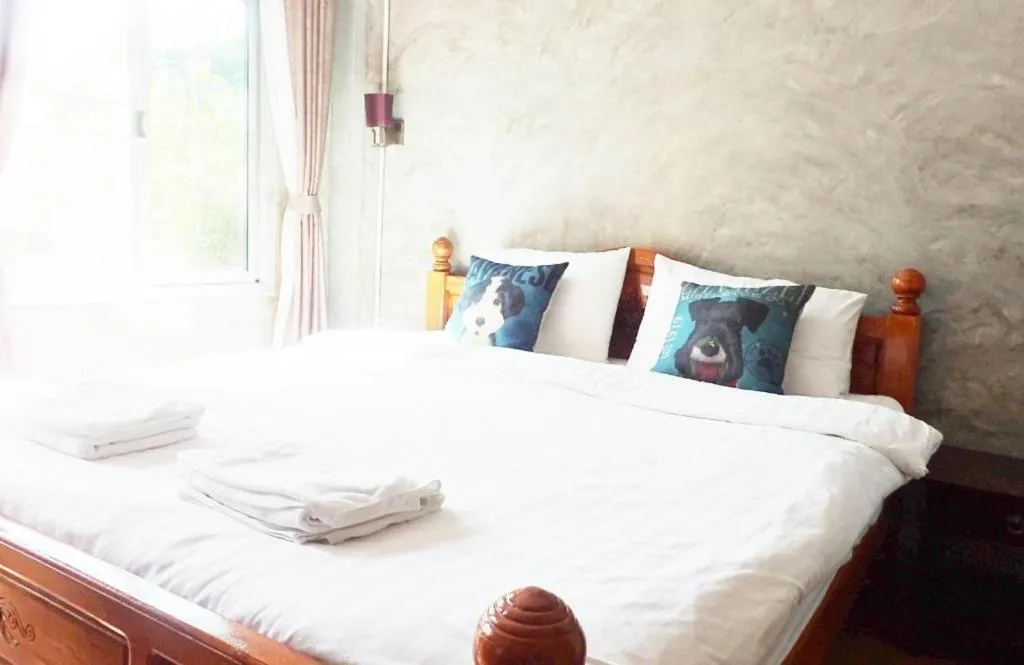 Bed in Rommai Rimnaam Resort