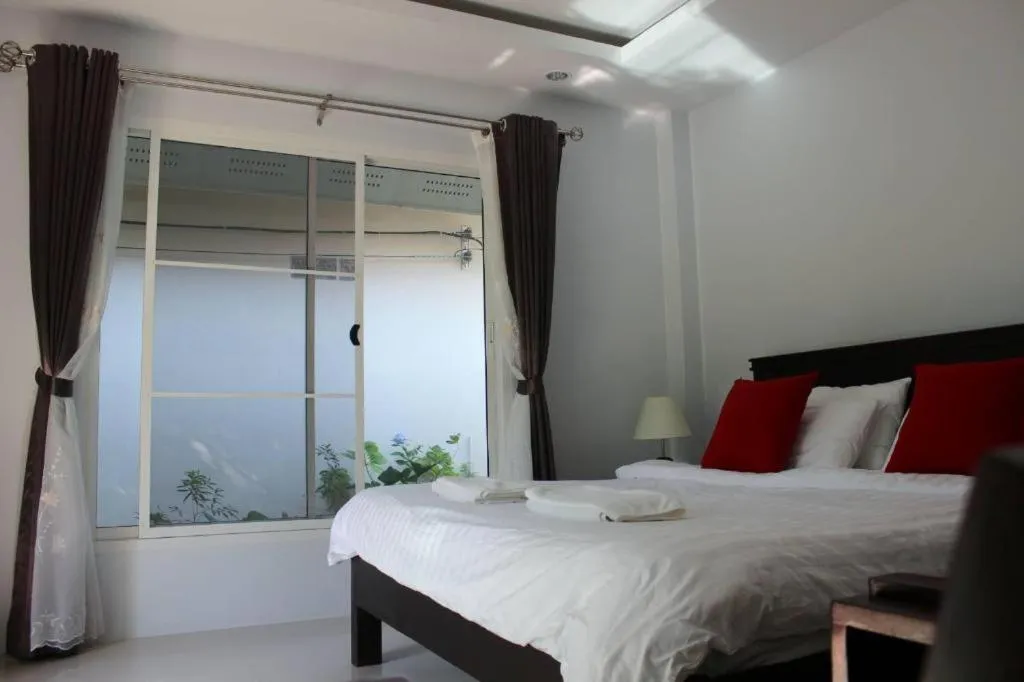 Bed in Rommai Rimnaam Resort