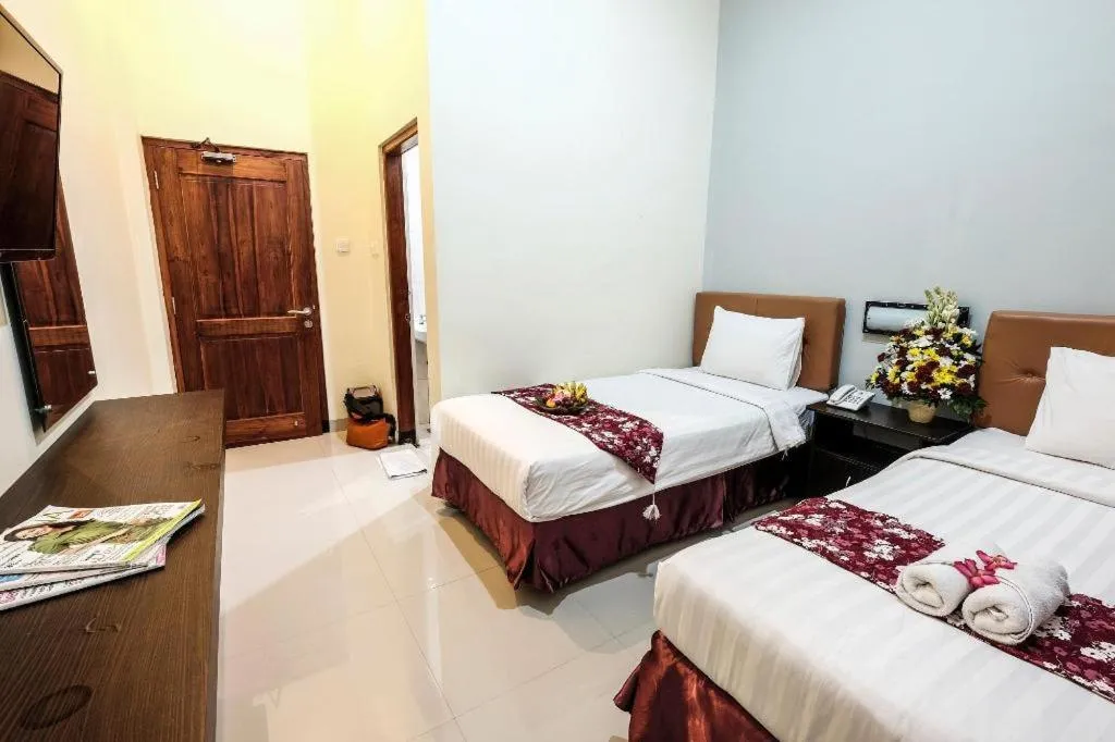 Bed in Malioboro Garden Hotel Yogyakarta