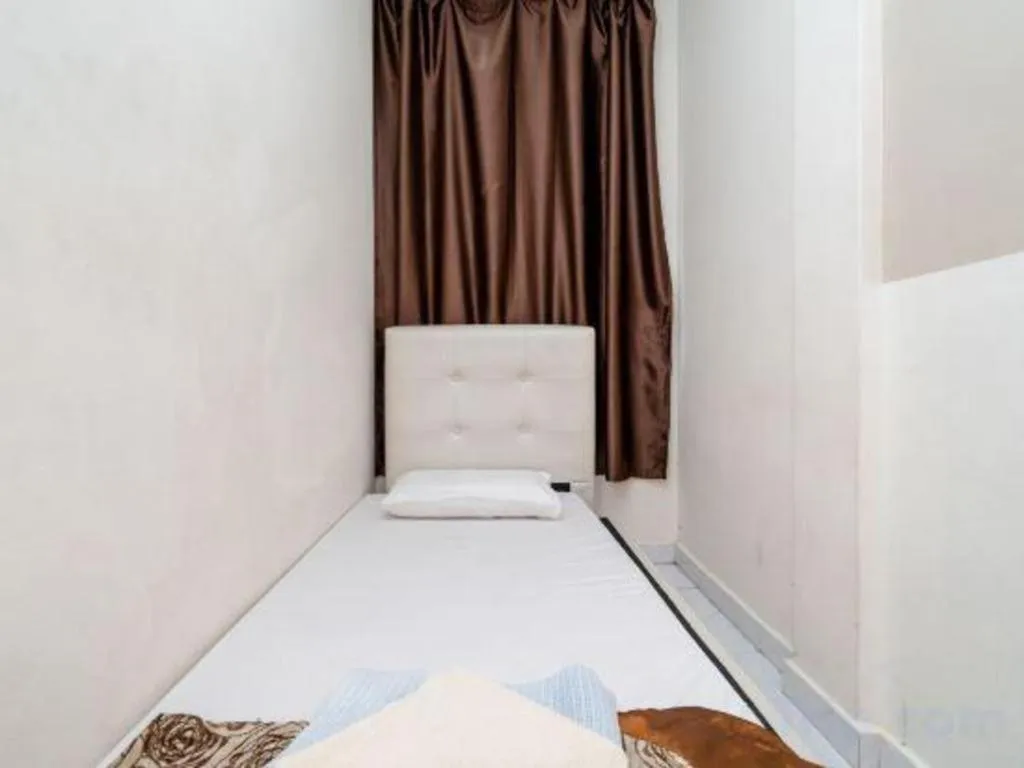 Bed in Lai Ming Hotel Cosmoland