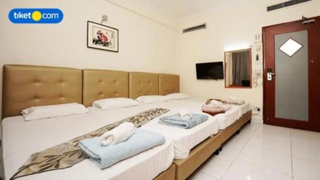 Bed in Lai Ming Hotel Cosmoland