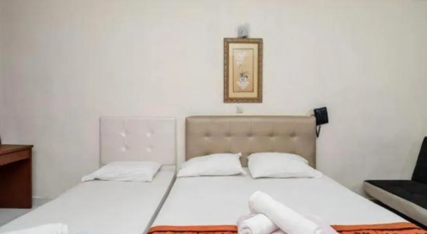 Bed in Lai Ming Hotel Cosmoland