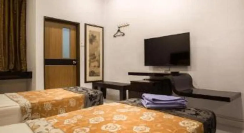 Bed in Lai Ming Hotel Cosmoland