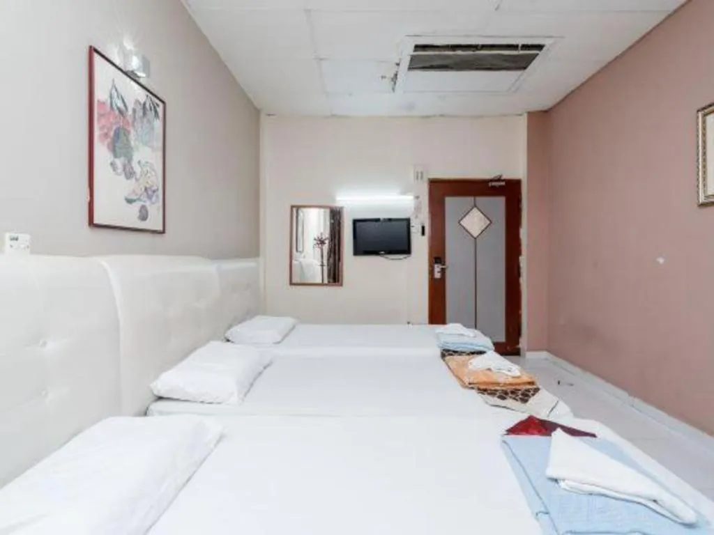 Bed in Lai Ming Hotel Cosmoland