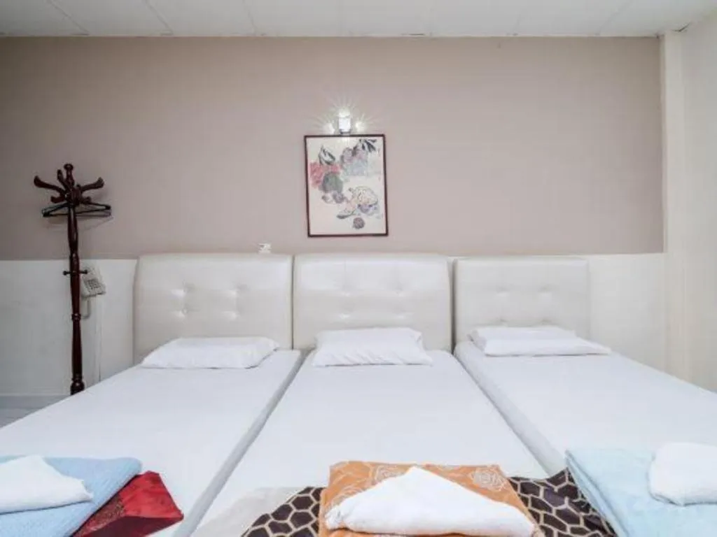 Bed in Lai Ming Hotel Cosmoland