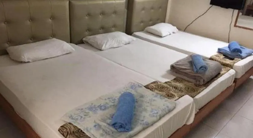 Bed in Lai Ming Hotel Cosmoland