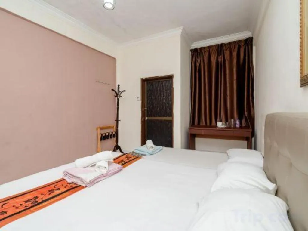 Bed in Lai Ming Hotel Cosmoland