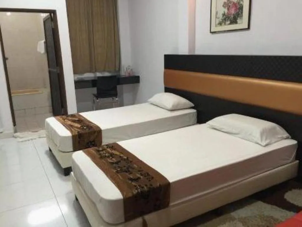 Bed in Lai Ming Hotel Cosmoland