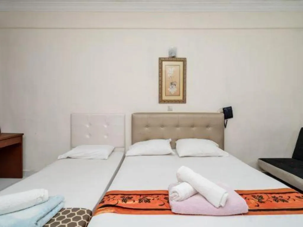 Bed in Lai Ming Hotel Cosmoland