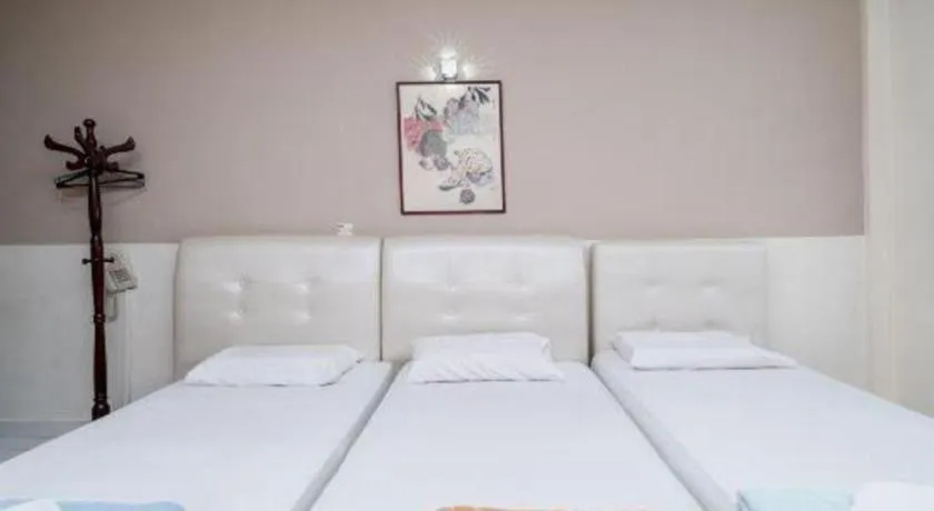 Bed in Lai Ming Hotel Cosmoland