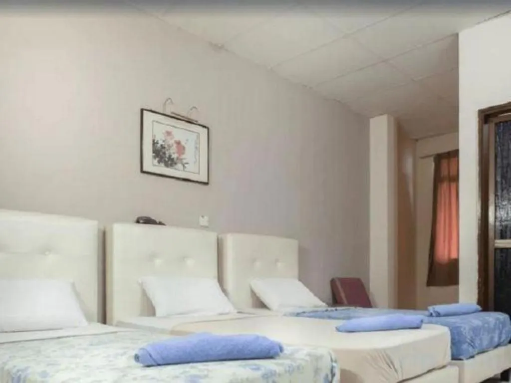 Bed in Lai Ming Hotel Cosmoland