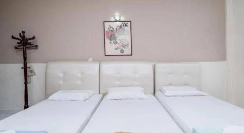 Bed in Lai Ming Hotel Cosmoland