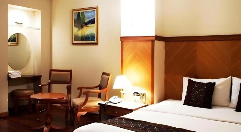 Bed in NH Elegant Hotel