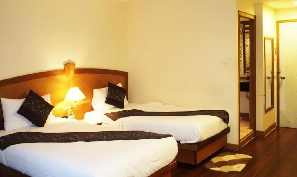 Bed in NH Elegant Hotel