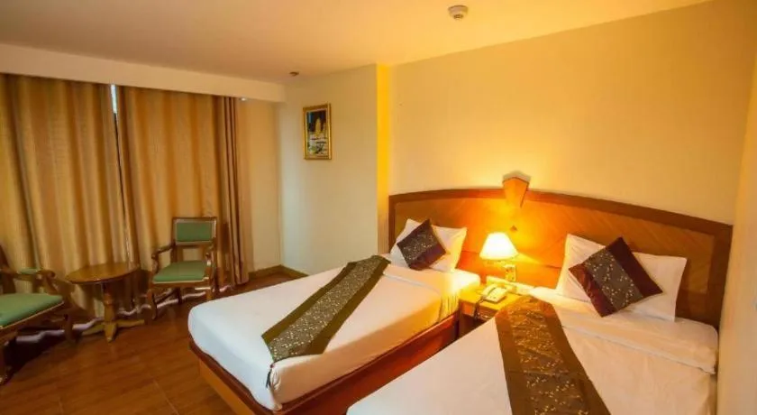 Bed in NH Elegant Hotel