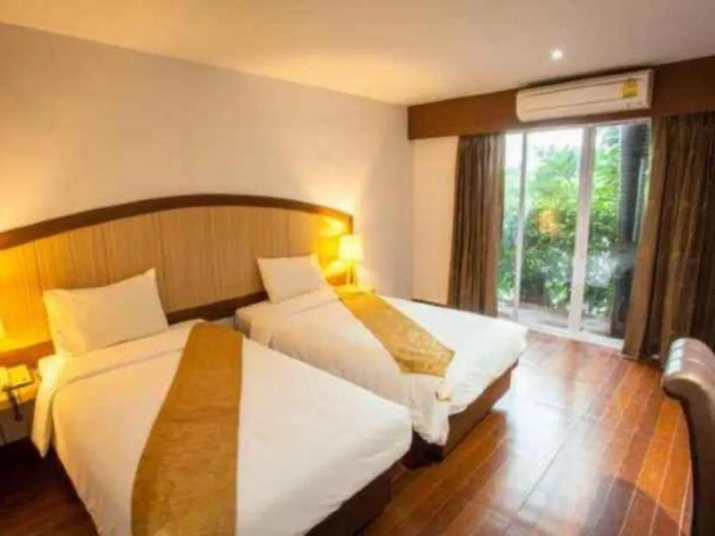 Bed in NH Elegant Hotel