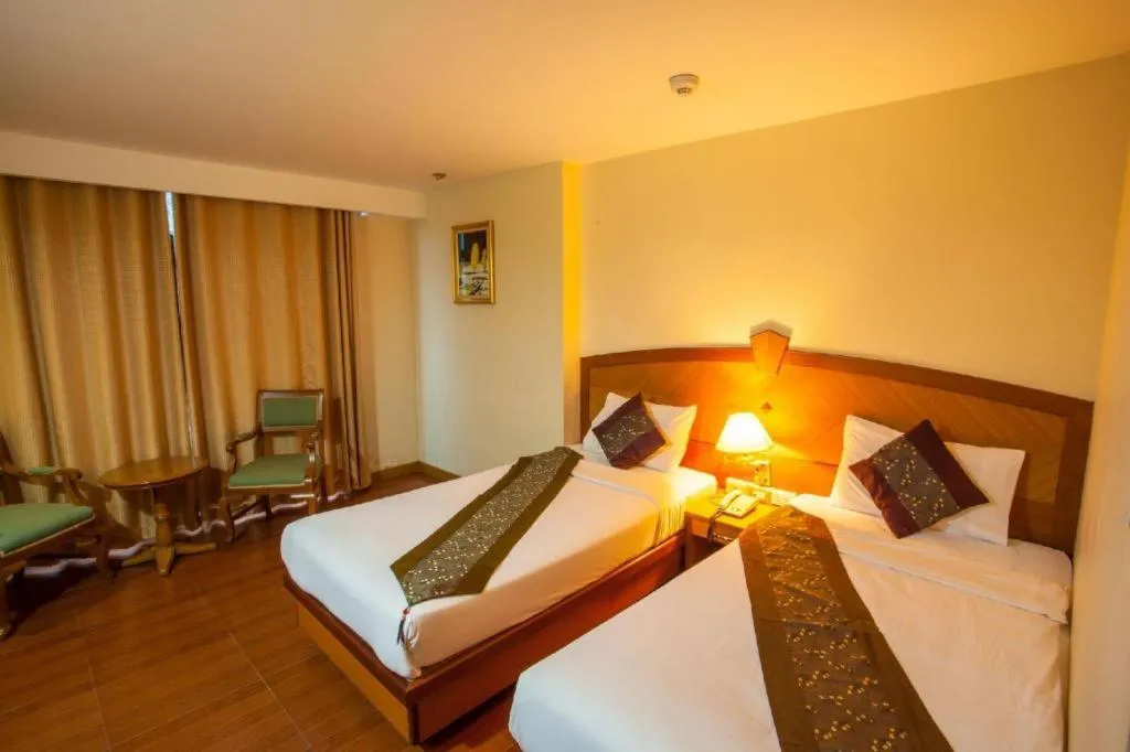 Bed in NH Elegant Hotel