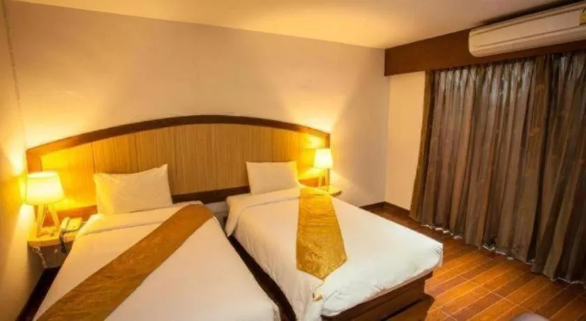 Bed in NH Elegant Hotel