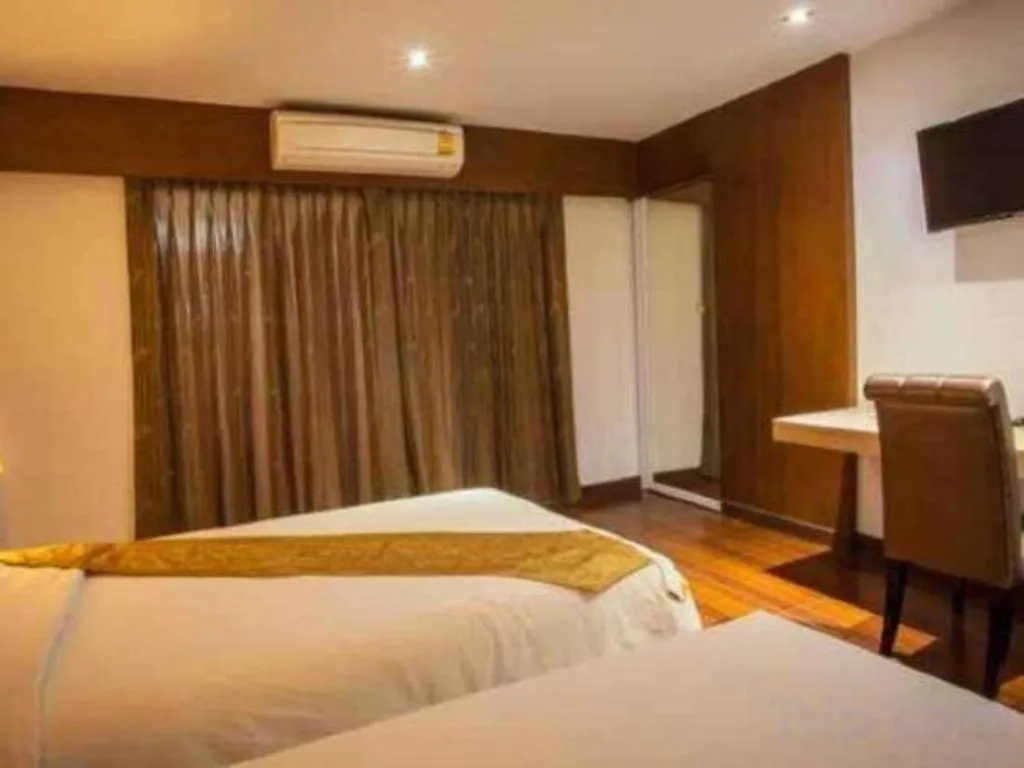 Bed in NH Elegant Hotel