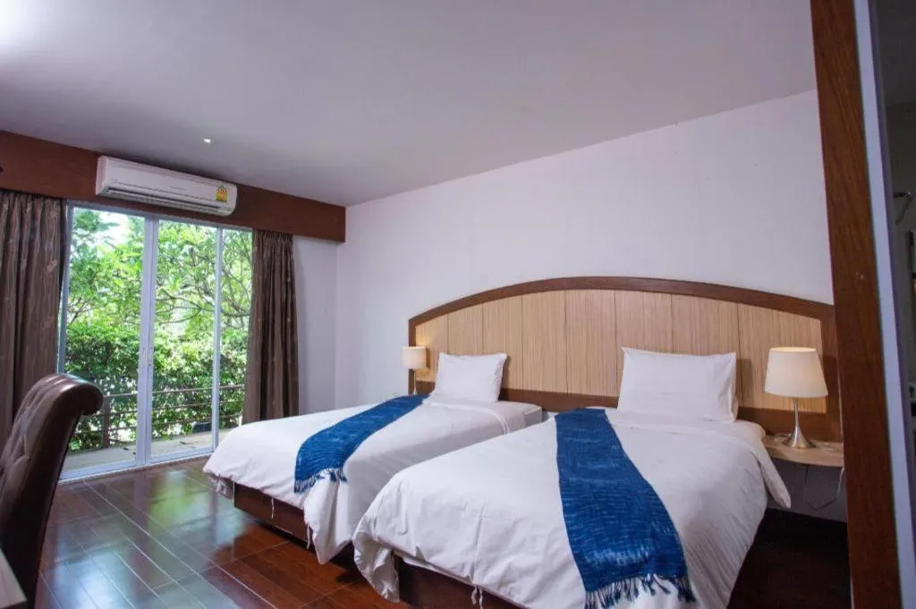 Bed in NH Elegant Hotel