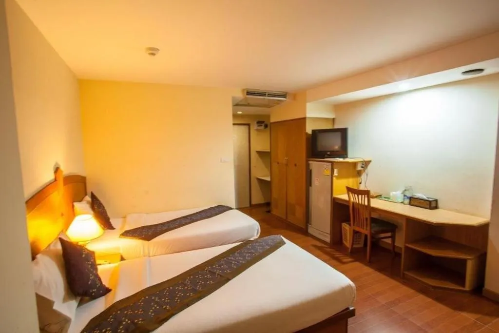 Bed in NH Elegant Hotel