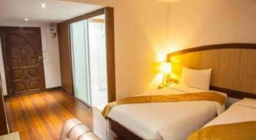 Bed in NH Elegant Hotel