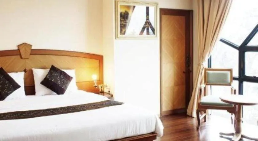 Bed in NH Elegant Hotel