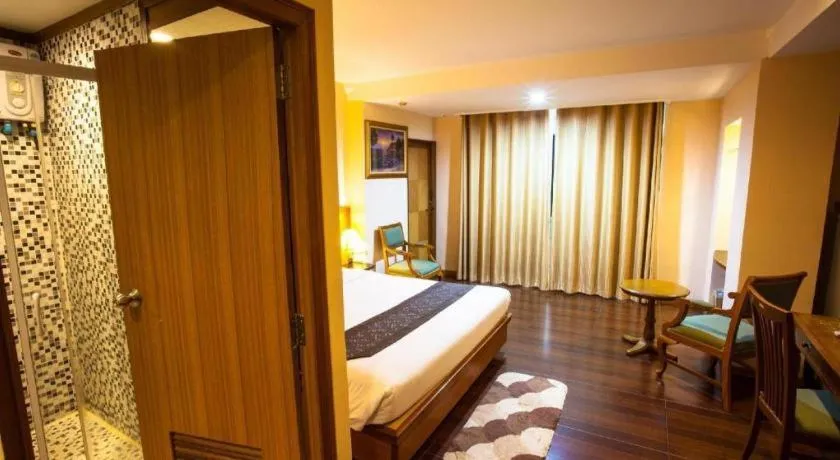 Bed in NH Elegant Hotel