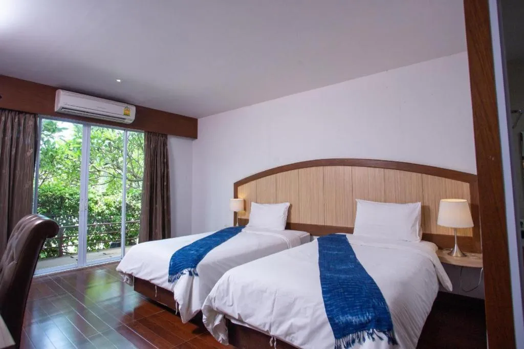 Bed in NH Elegant Hotel