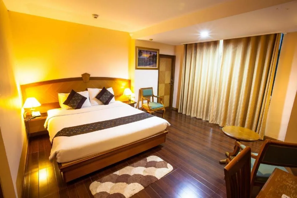 Bed in NH Elegant Hotel