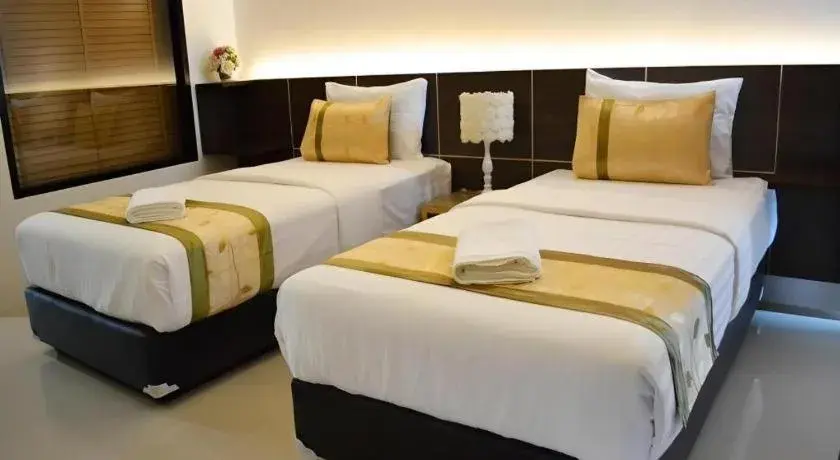 Bed in The Convenience Hotel Bed in The Convenience Hotel