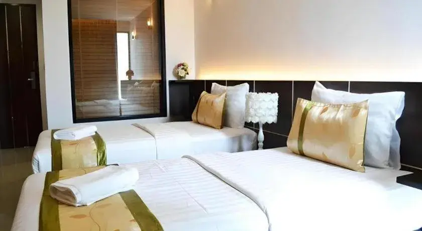 Bed in The Convenience Hotel Bed in The Convenience Hotel