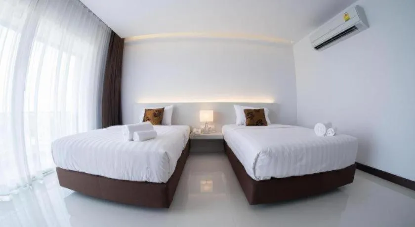 Bed in Chaisaeng Villa