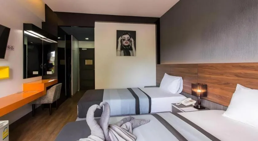 Bed in The Loft Seaside Sriracha Hotel