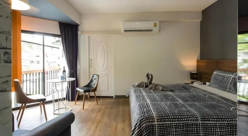 Bed in The Loft Seaside Sriracha Hotel