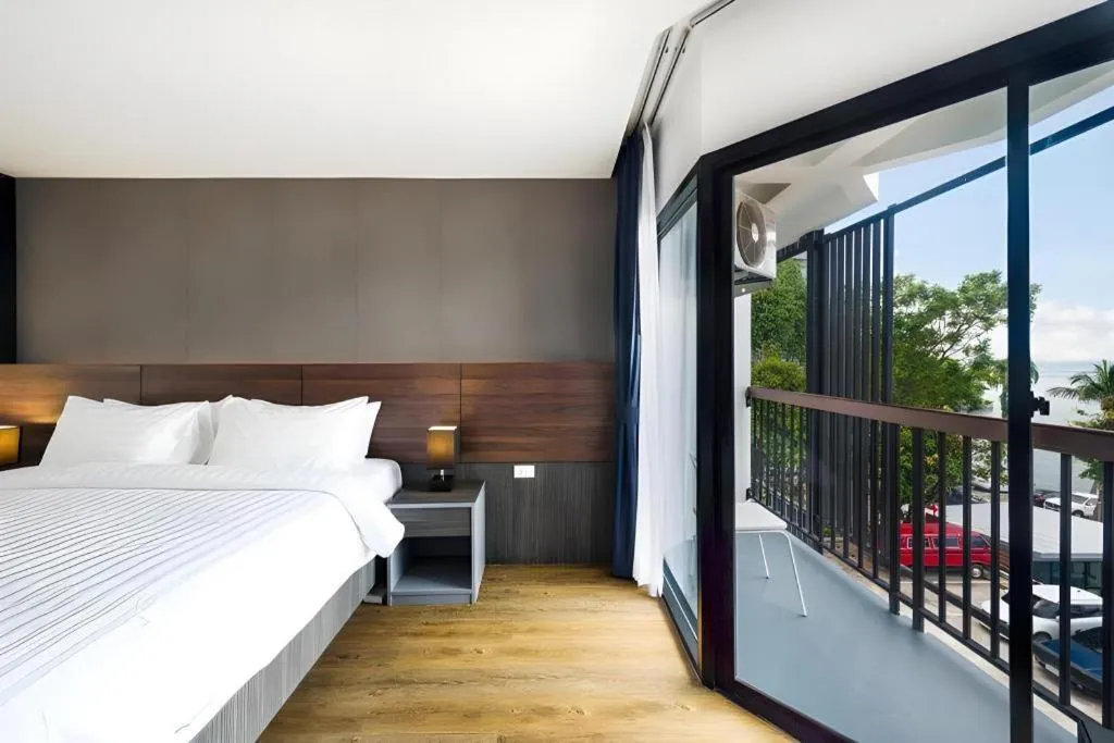 Bed in The Loft Seaside Sriracha Hotel