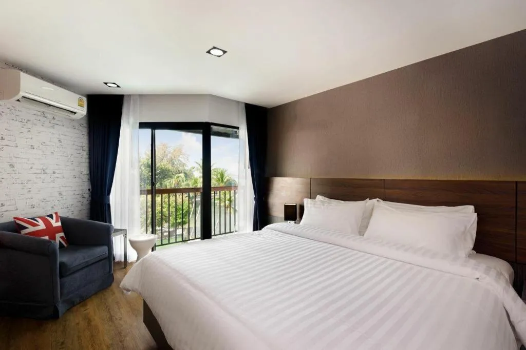 Bed in The Loft Seaside Sriracha Hotel