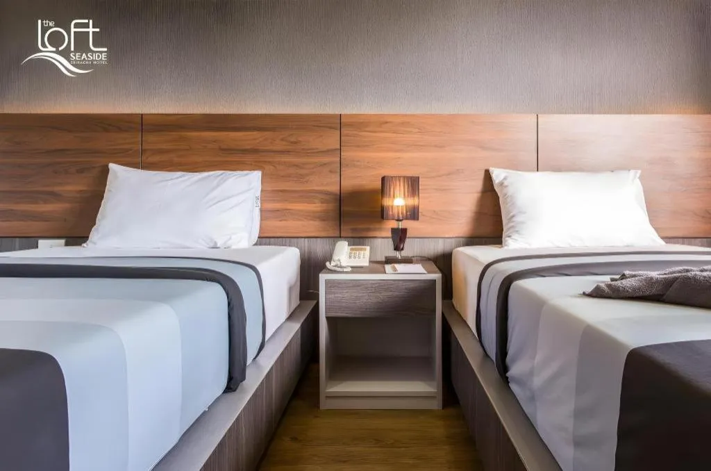 Bed in The Loft Seaside Sriracha Hotel