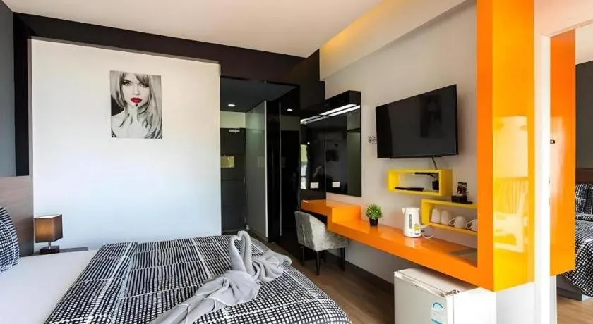 Bed in The Loft Seaside Sriracha Hotel