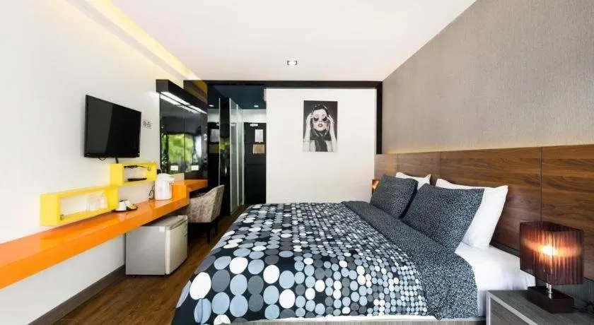 Bed in The Loft Seaside Sriracha Hotel