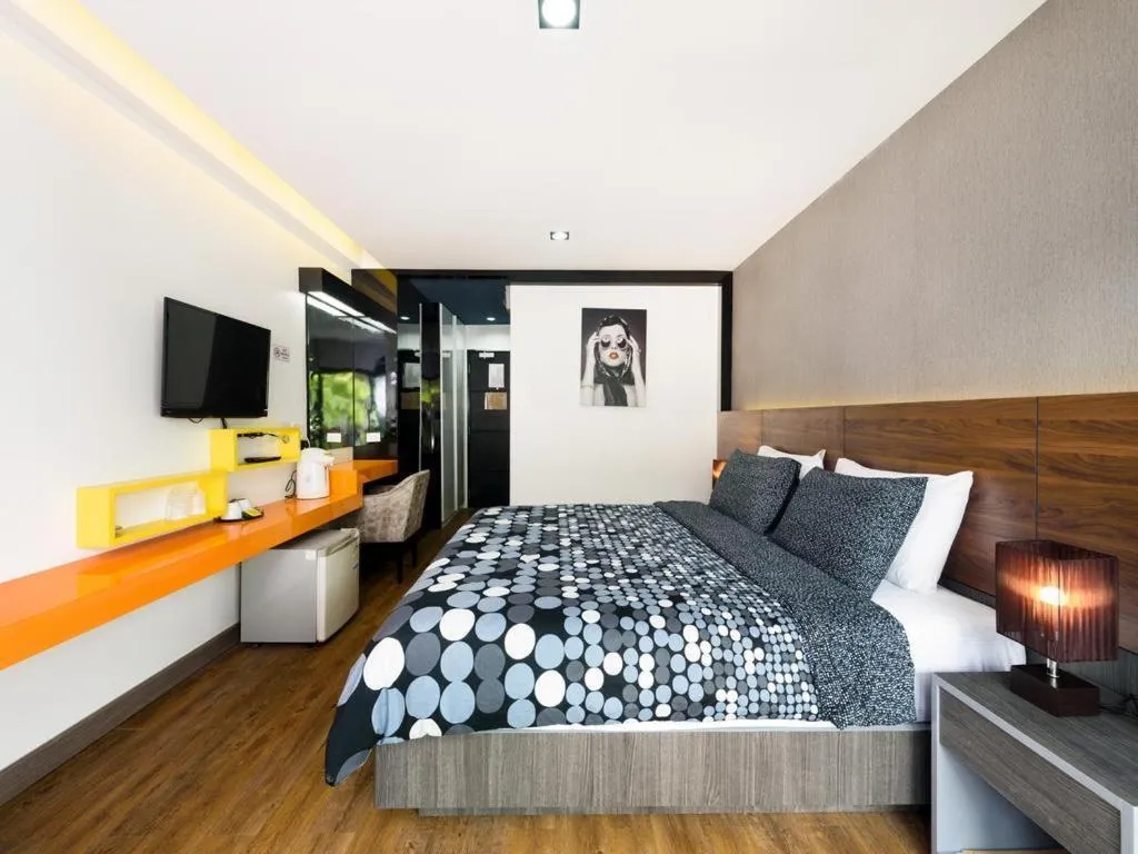 Bed in The Loft Seaside Sriracha Hotel