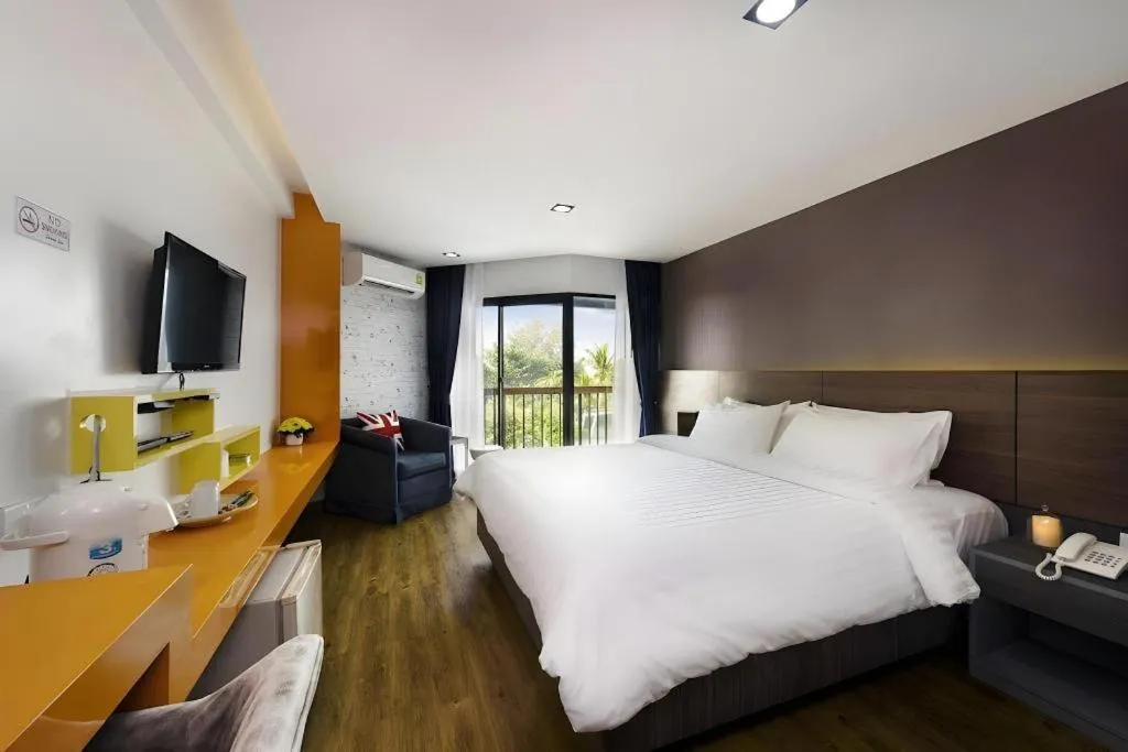 Bed in The Loft Seaside Sriracha Hotel