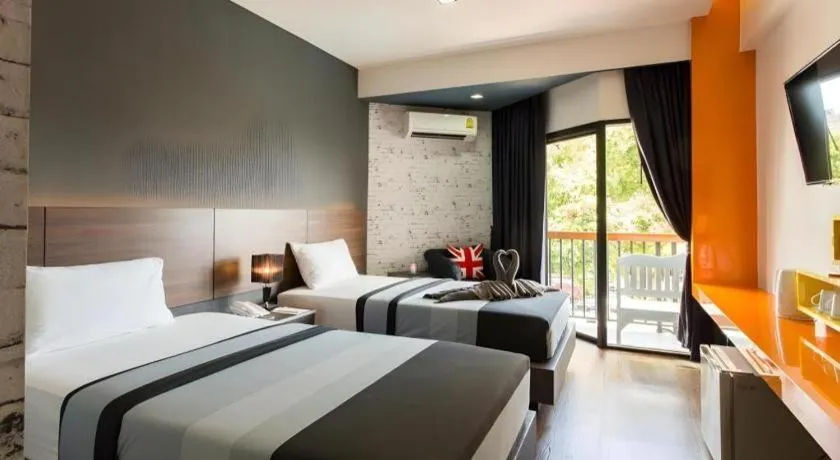 Bed in The Loft Seaside Sriracha Hotel