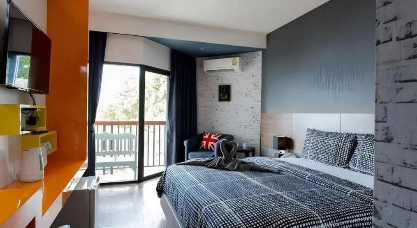 Bed in The Loft Seaside Sriracha Hotel