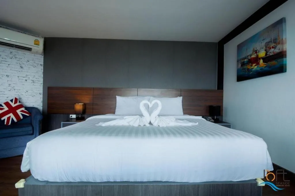 Bed in The Loft Seaside Sriracha Hotel