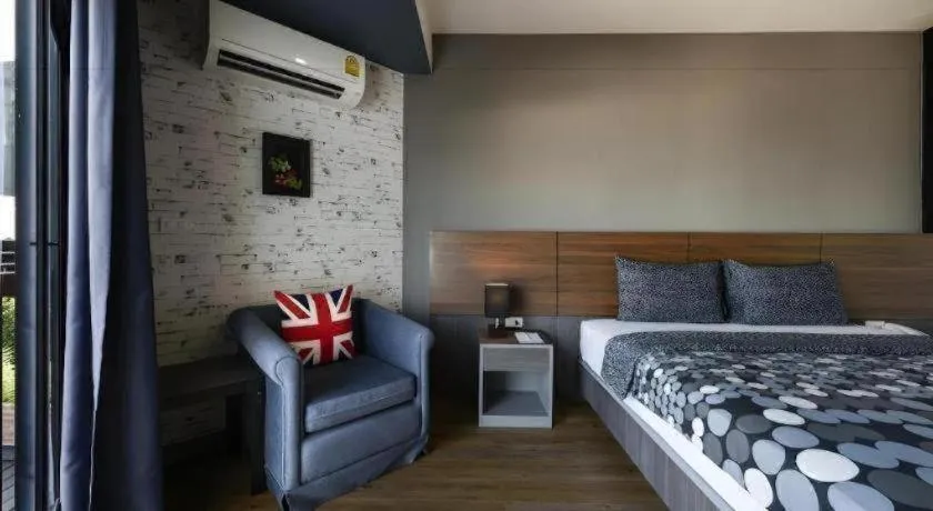 Bed in The Loft Seaside Sriracha Hotel