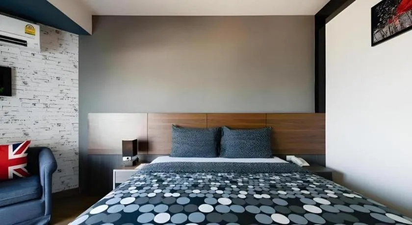 Bed in The Loft Seaside Sriracha Hotel