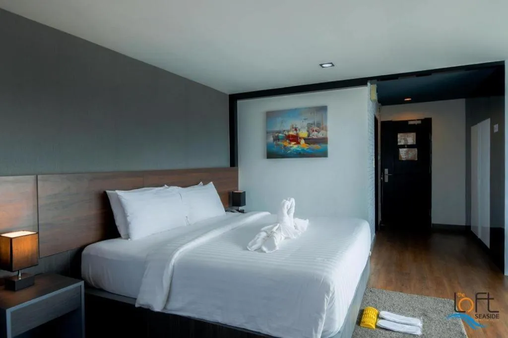 Bed in The Loft Seaside Sriracha Hotel